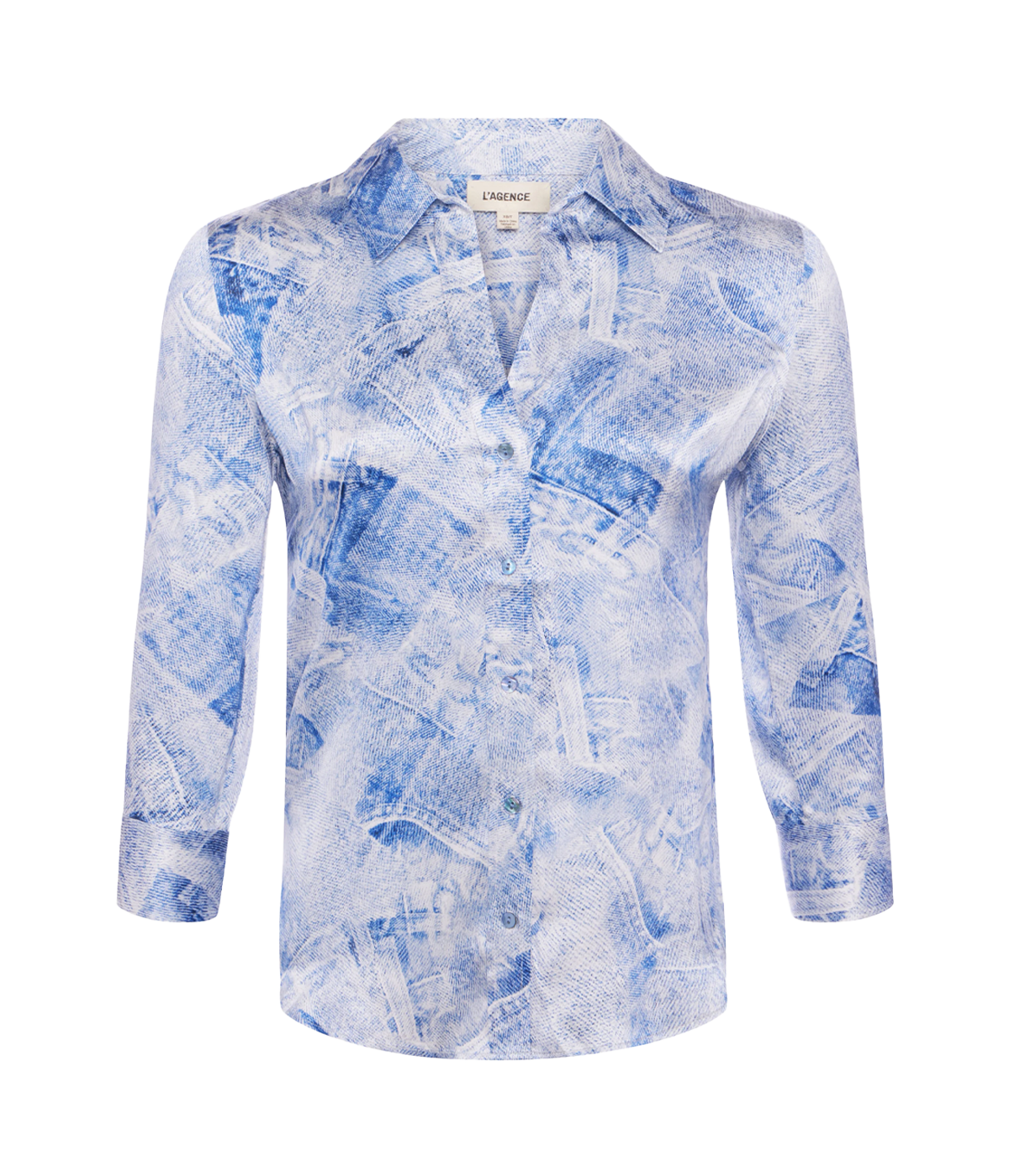 Elegant silk button-down blouse with a high-low hem, styled for a chic and versatile look.