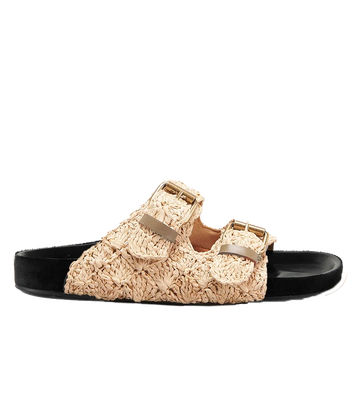 Isabel Marant’s iconic Lennyo Sandal in raffia and leather, with a contrasting black sole. The perfect slip on Birkenstock style shoe to wear all summer, with a moulded footbed for comfort. 