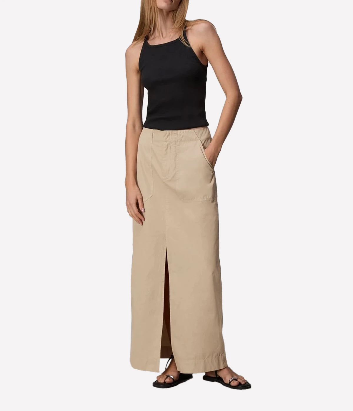 ALT Text for Product Image: Maxi skirt in lightweight Italian cotton with utilitarian details, including a zip closure and keeper button, styled for casual and polished looks.