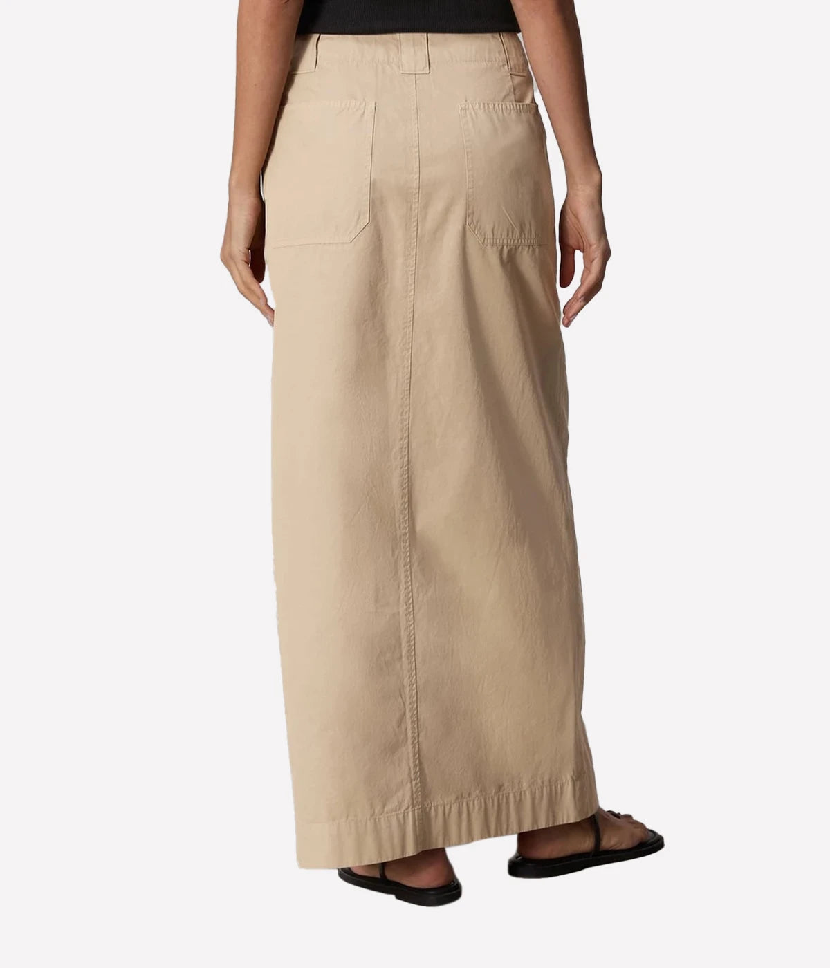 ALT Text for Product Image: Maxi skirt in lightweight Italian cotton with utilitarian details, including a zip closure and keeper button, styled for casual and polished looks.