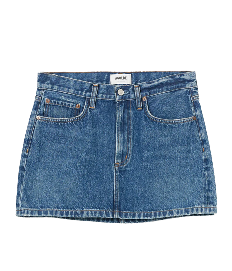 A classic medium wash mini skirt made from rigid denim, featuring a zip and button closure, 5 pocket detail, clean hem and low waist style. Summer staple, everyday basic, date night skirt, made in USA. 