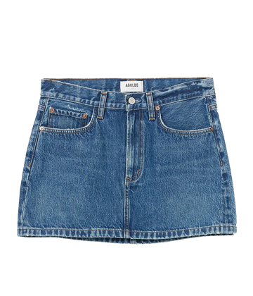 A classic medium wash mini skirt made from rigid denim, featuring a zip and button closure, 5 pocket detail, clean hem and low waist style. Summer staple, everyday basic, date night skirt, made in USA. 