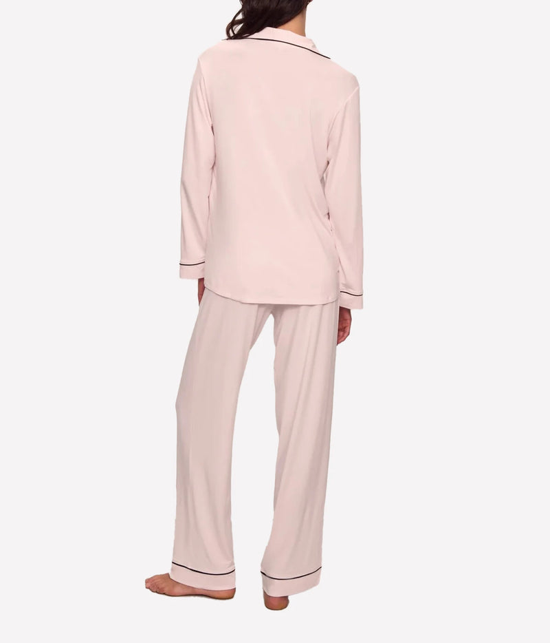 Side view of a model wearing the Eberjey Gisele Long Sleeve PJ Set in Sorbet Pink & Black, showing the relaxed fit of the top and full-length pants