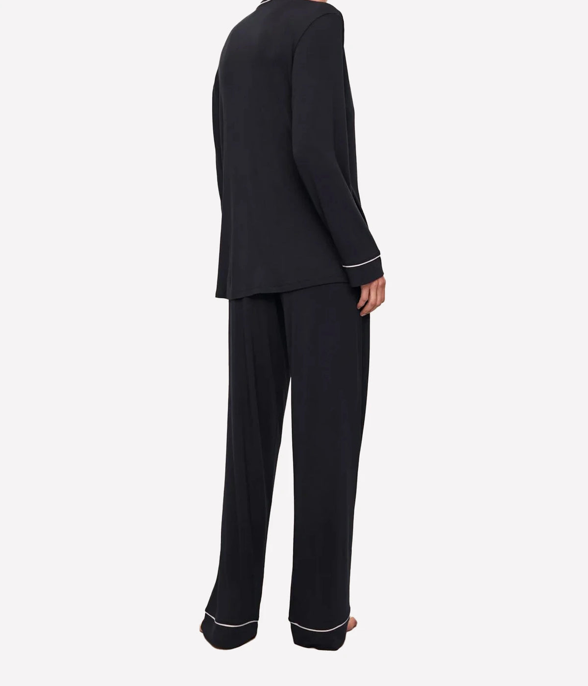 Back view of a model wearing the Eberjey Gisele Long Sleeve PJ Set in Black & Sorbet Pink, showing the long sleeve top and full-length pants