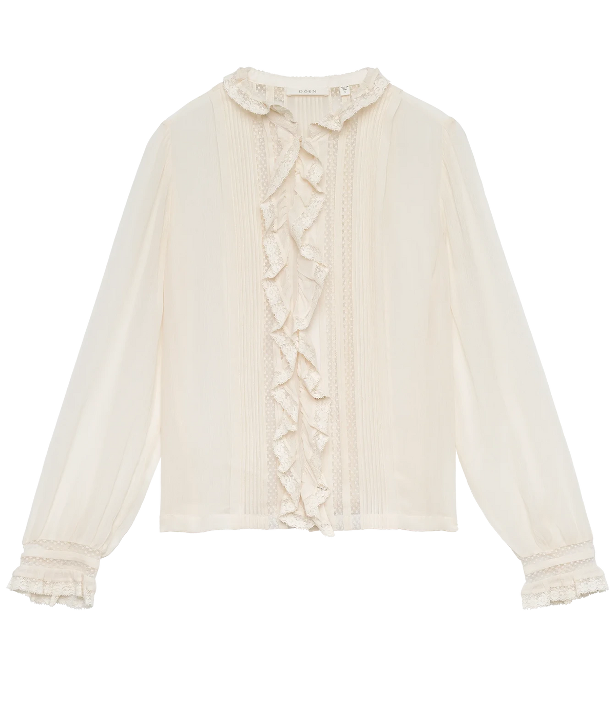 DÔEN Magdeleine Top In Candlelight laid flat, showing the ruffled stand collar, ruffle trim down the front, pintuck detailing and long sleeves with ruffled cuffs