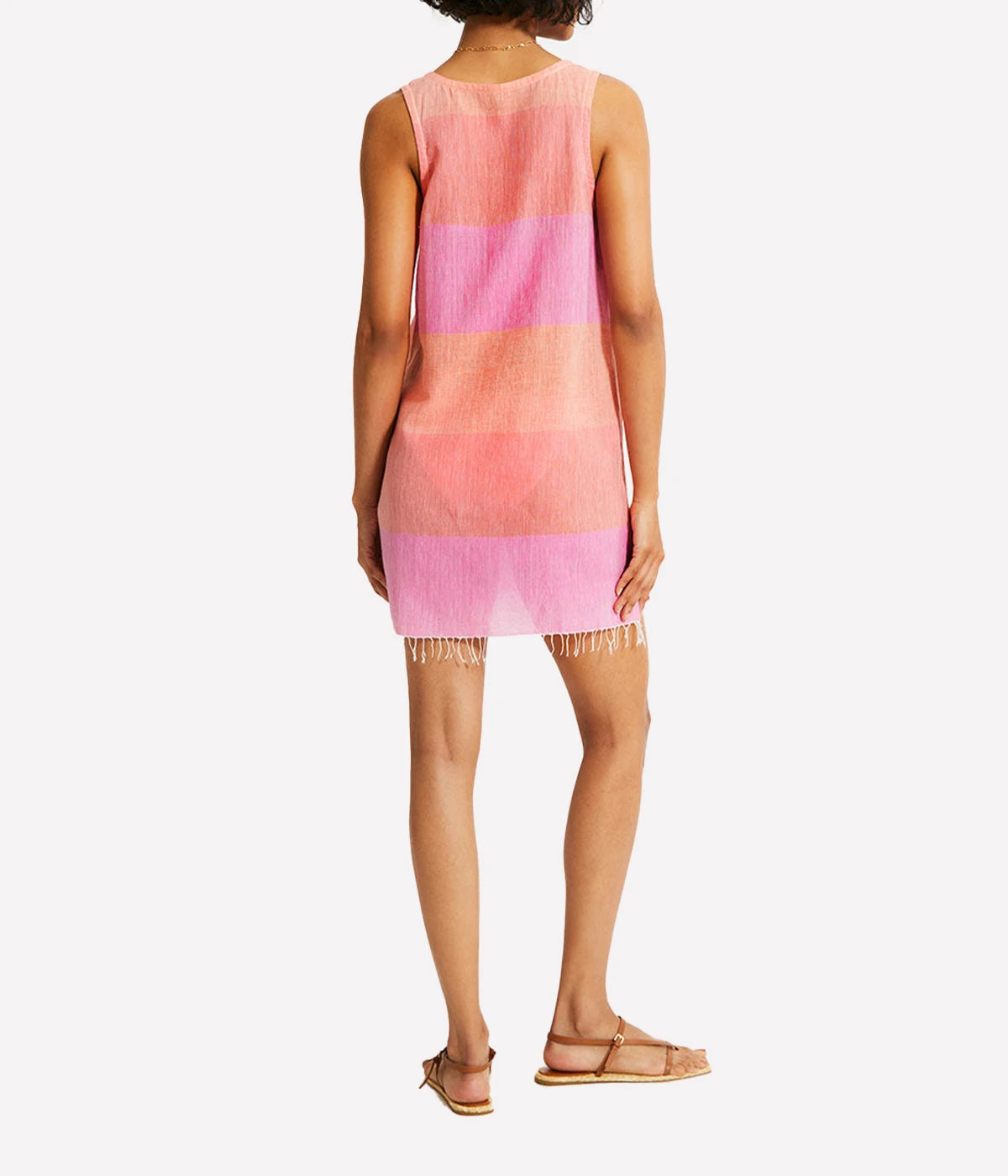 A relaxed tank dress featuring an ombre colour block in pink, blush, and peach, with a scoop neckline and fringe hem detail.