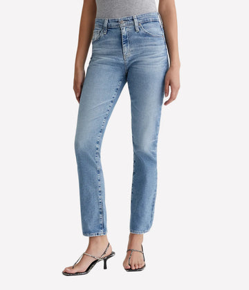 A high rise, slim straight jean in a a light blue wash with heavy fading and distressed pockets. Pair this versatile wash & wear jean with anything in your closet! 