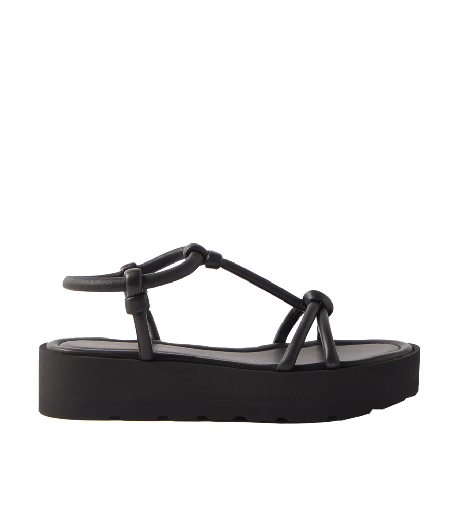 Black slip-on leather sandals. Easy to wear summer shoe, pair with your favourite summer outfit. Knotten details atop a thick rubber platform. All day comfort, perfect for walking.  