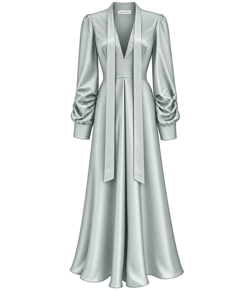 Raquel Diniz Valerie Dress in Mint laid flat, showing the muted mint silk, plunging V-neckline, long neck ties, gathered long sleeves with buttoned cuffs and pleated flared maxi skirt