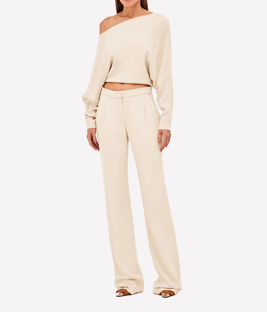 A versatile off the shoulder cream blouse, featuring a crop style and billowy fit. Bra friendly, comfortable, made internationally, chic, date night top. 