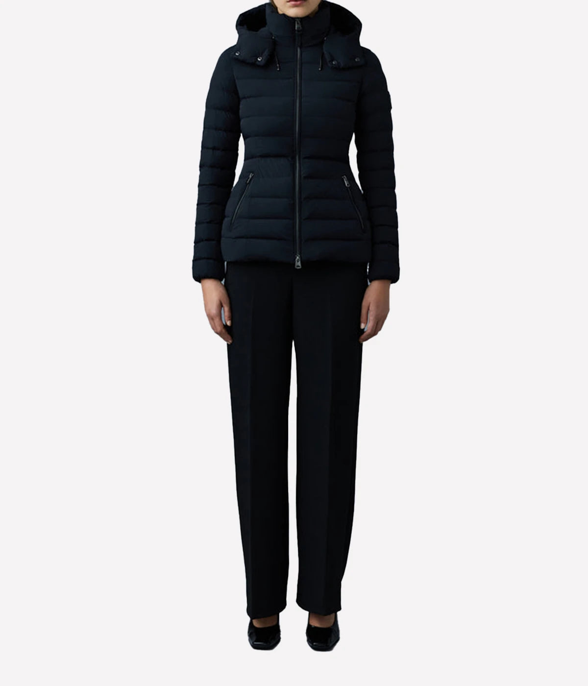 The fitted silhouette is enhanced by streamlined panel construction and an elastic waist-back insert for a flattering, cinched shape.