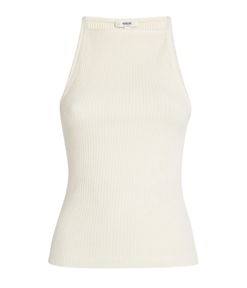 An elevated basic tank, made from a soft rib cotton and in a classic beige colourway. Featuring a high neckline, long bodice and flattering fit. Summer staple, bra friendly, date night top, made in USA, comfortable, elevated basic, date night top.