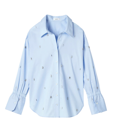 A standout special occasion button down shirt, in a sky blue colour way and featuring crystal embellishments puff sleeve and elasticated wrist. Throw on and go, elevated basic, made in USA, cotton, bra friendly. 