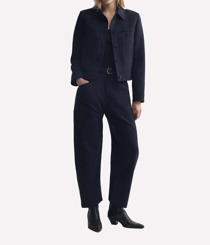 Model wearing Nili Lotan Shon Wool Pant in Midnight with matching cropped jacket, full-length front view