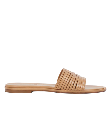 An everyday elevated flat sandal, with a minimalist design, delicate mignon detailing, slip on style and round toe all in a hazelnut colourway. Made in Italy, comfortable, Europe summer, everyday sandal.  