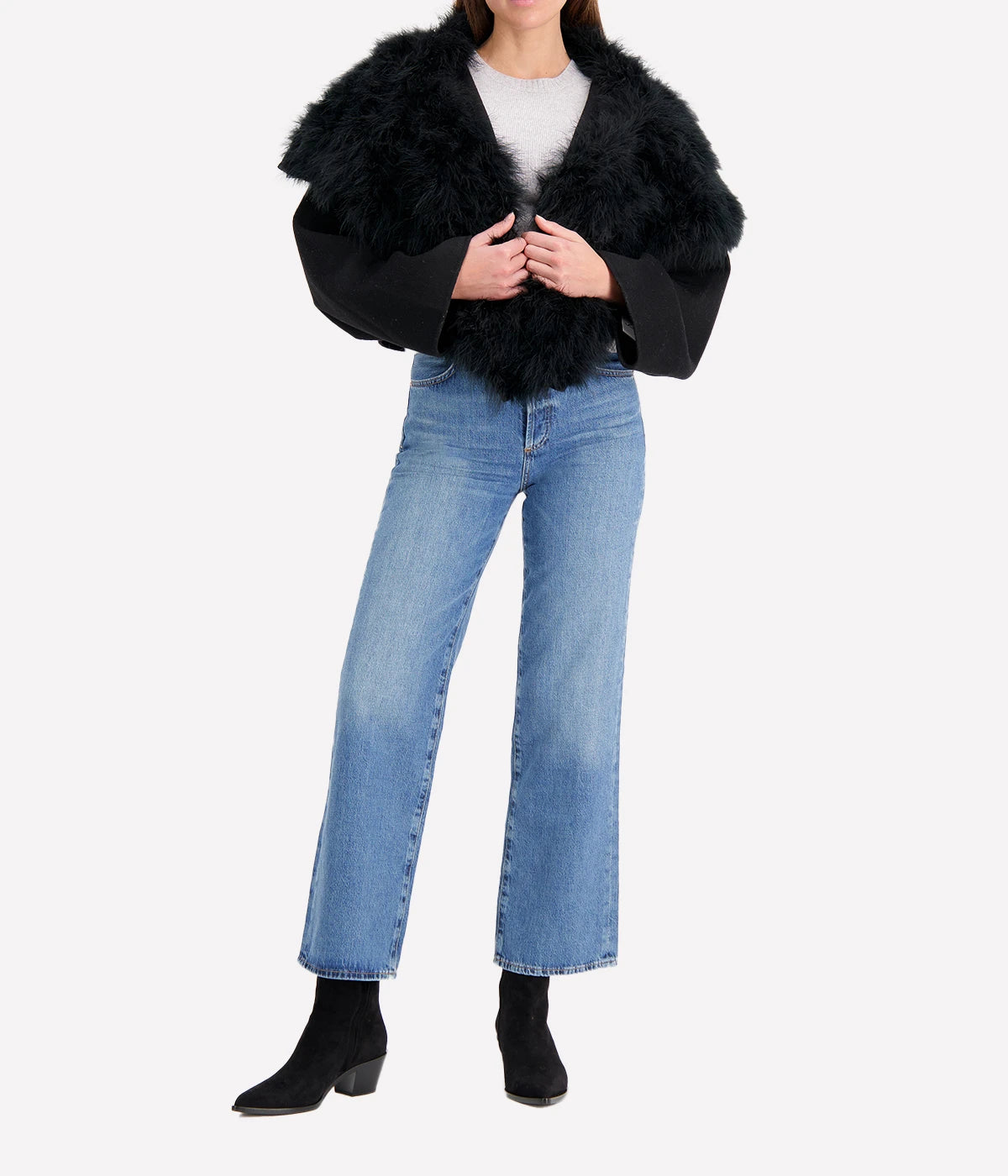 Albatre-hued jacket featuring cashmere, wool, and feather details, styled with a chic winter outfit for a sophisticated look.
