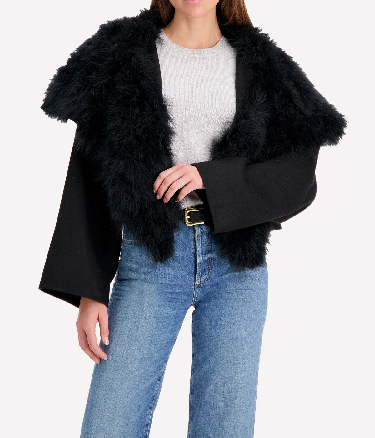 Albatre-hued jacket featuring cashmere, wool, and feather details, styled with a chic winter outfit for a sophisticated look.