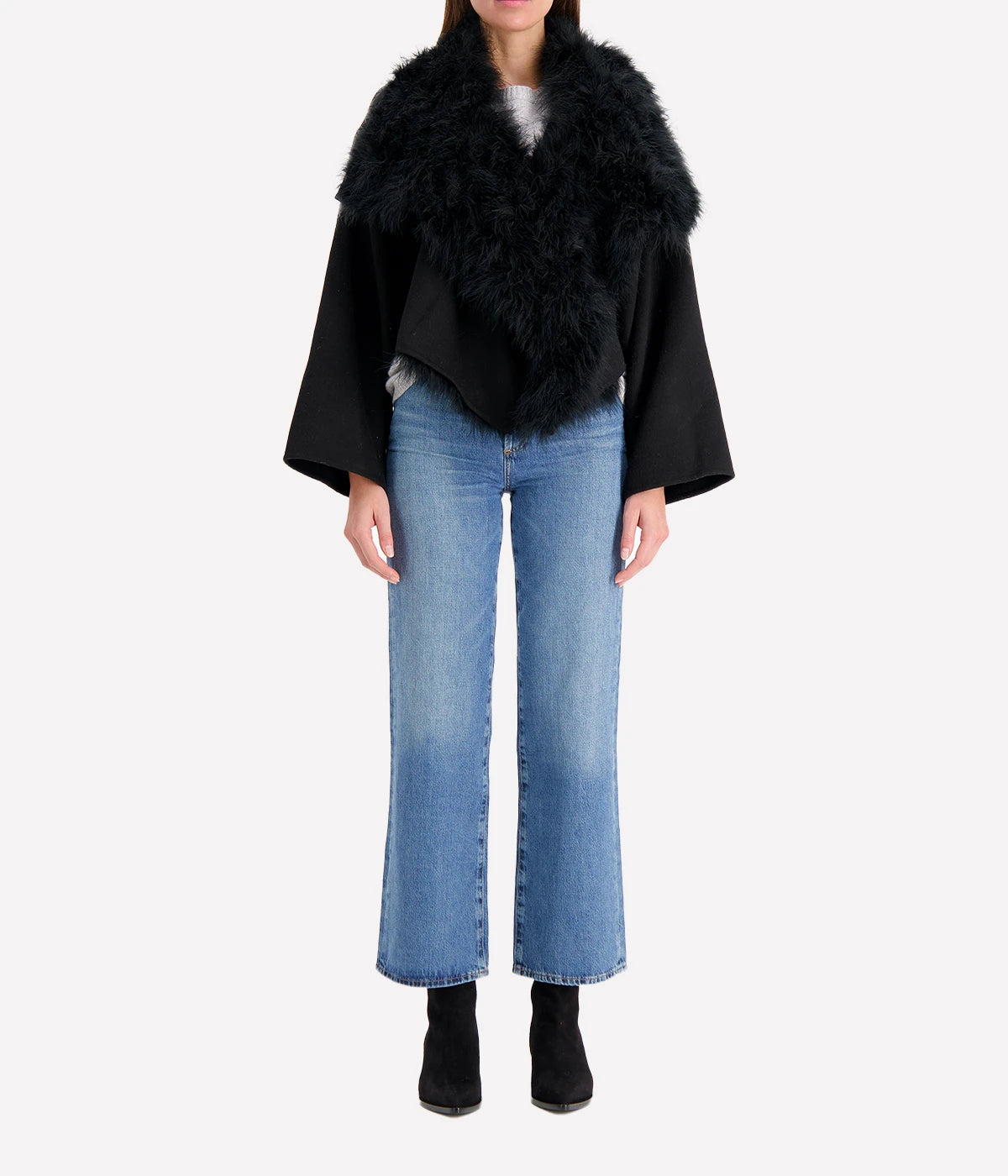 Albatre-hued jacket featuring cashmere, wool, and feather details, styled with a chic winter outfit for a sophisticated look.