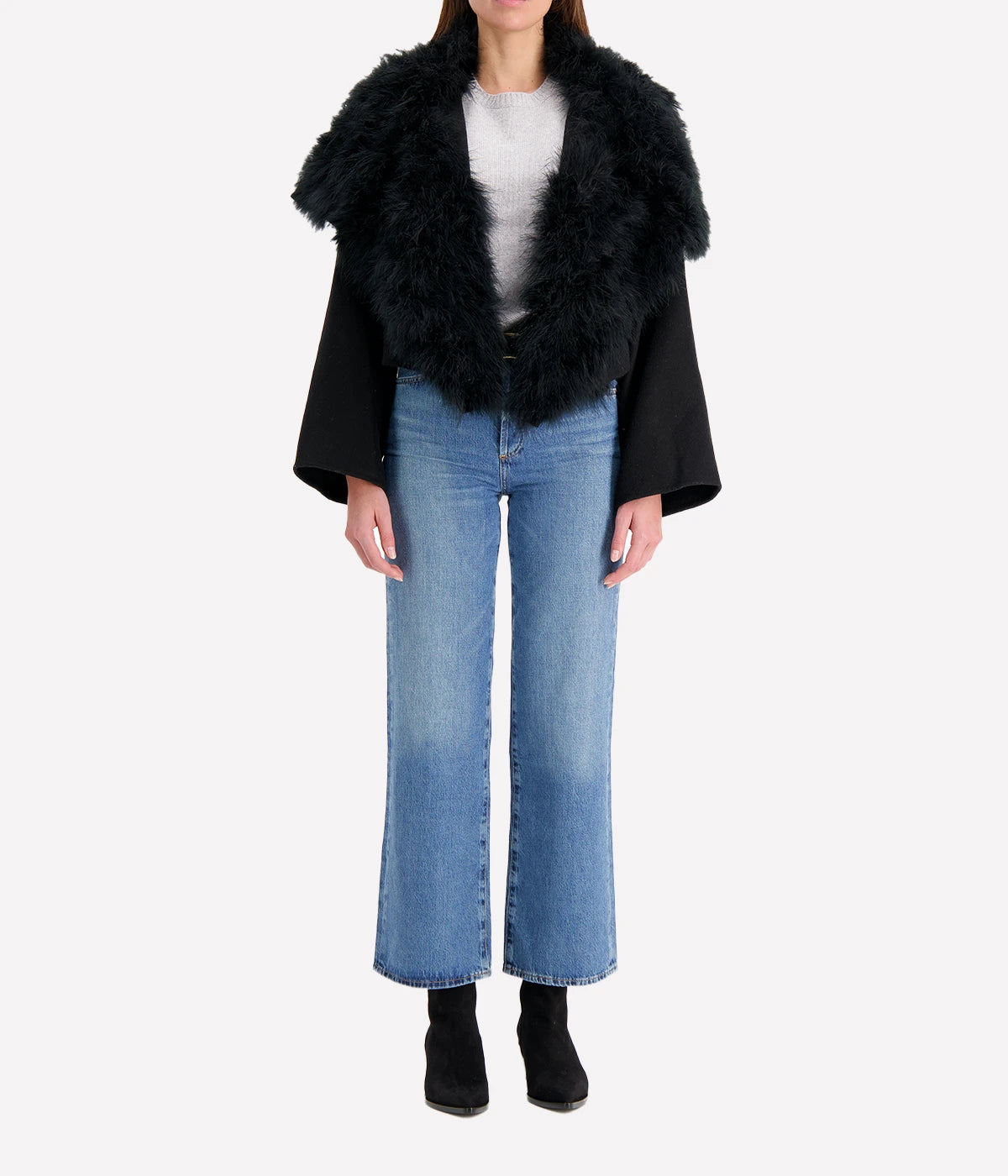 Albatre-hued jacket featuring cashmere, wool, and feather details, styled with a chic winter outfit for a sophisticated look.