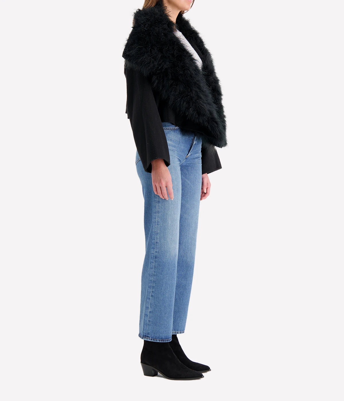 Albatre-hued jacket featuring cashmere, wool, and feather details, styled with a chic winter outfit for a sophisticated look.