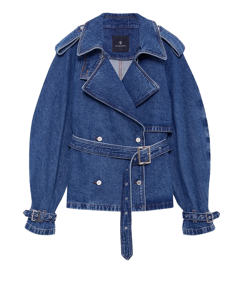 A blue denim belted jacket with a double-breasted design, wide collar, and matching denim cuffs, shown on a plain white background.