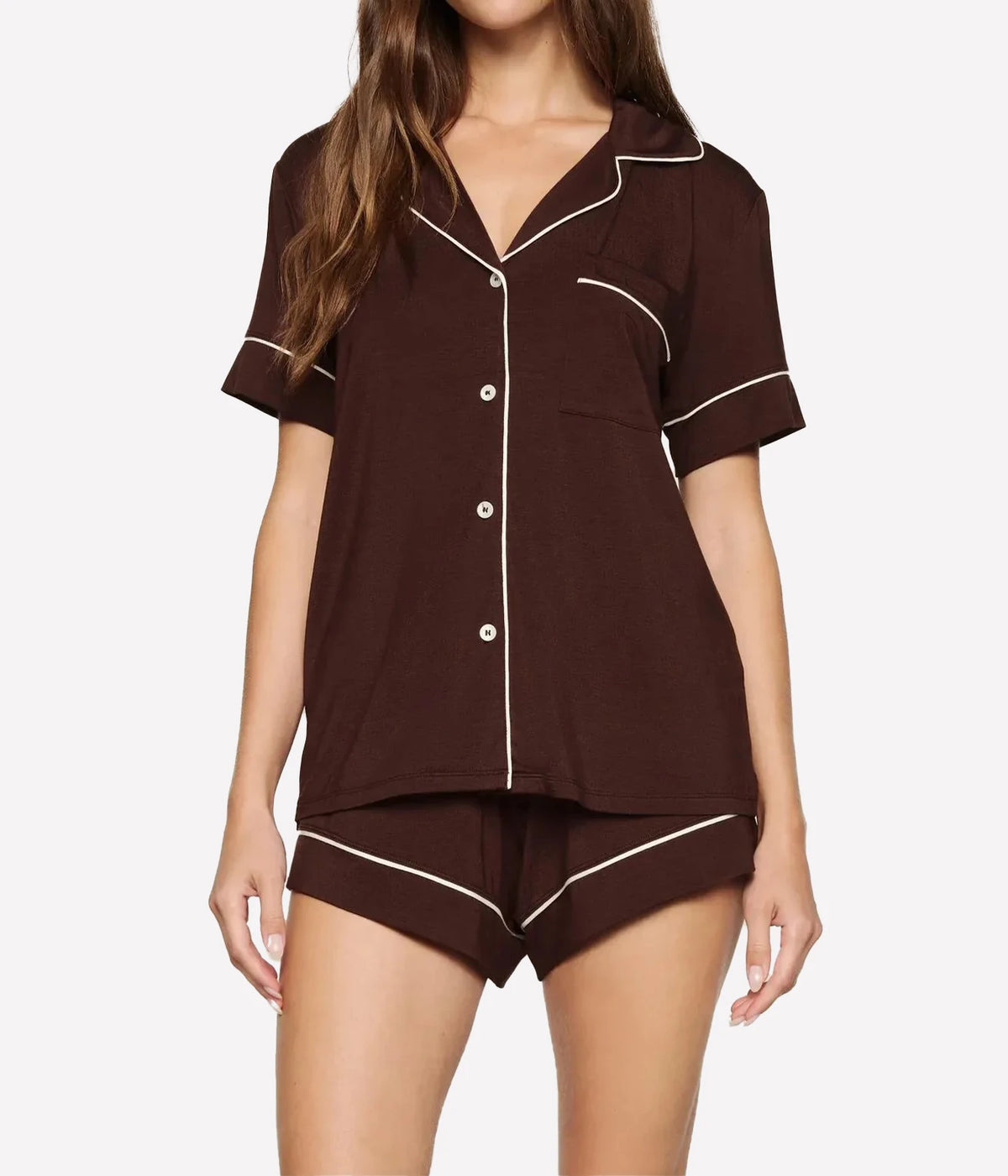 Model wearing the Eberjey Gisele Relaxed Short PJ Set in Chocolate & Ivory, front view showing the short sleeve button-up top with notch collar, chest pocket and contrast ivory piping, with matching piped shorts
