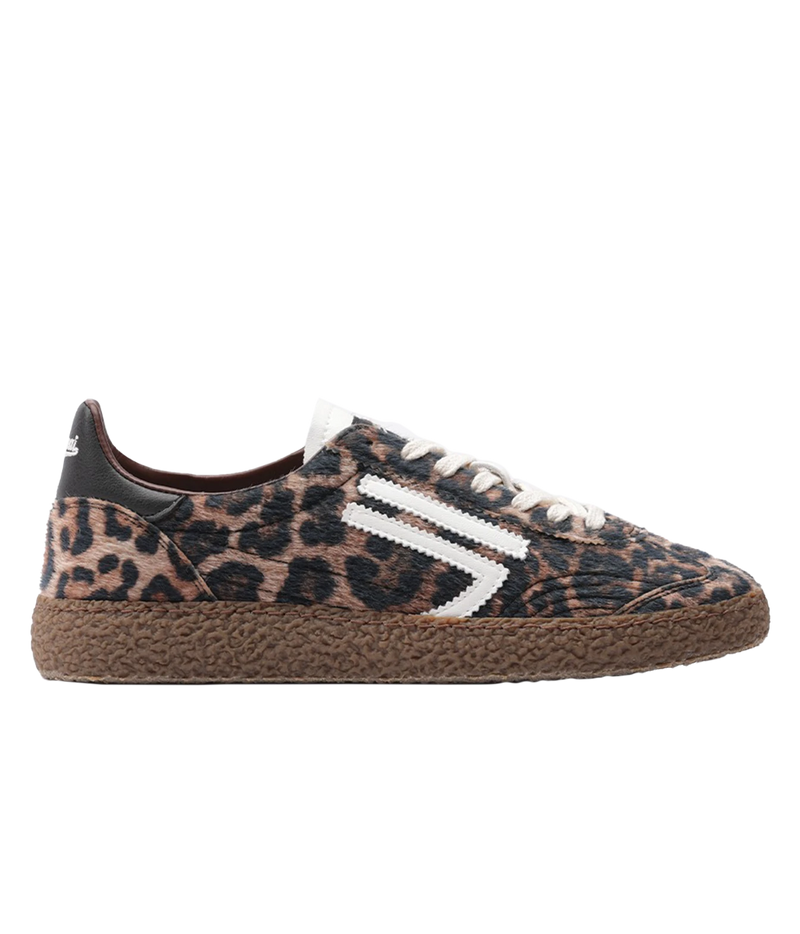 A low-top sneaker featuring a brown and black leopard print upper, white laces, a white side stripe detail, and a brown textured espadrille sole, shown in profile against a white background.