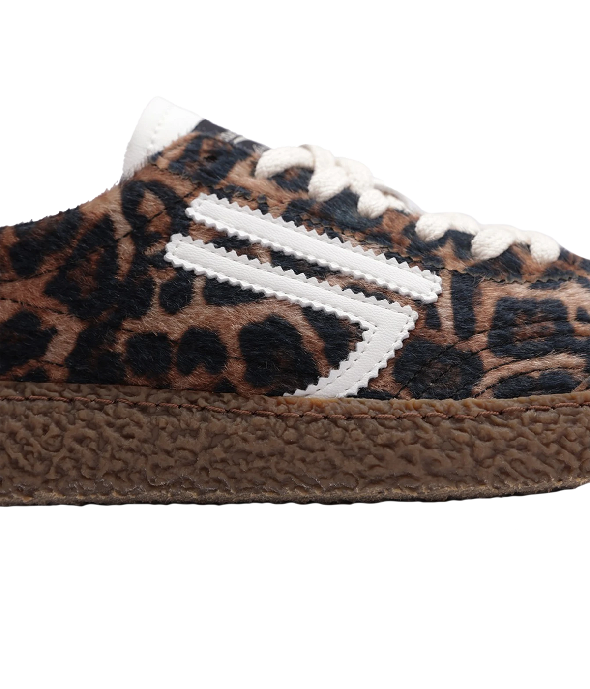 A close-up of a low-top sneaker featuring a brown and black leopard print pattern, white laces, and a textured brown sole.