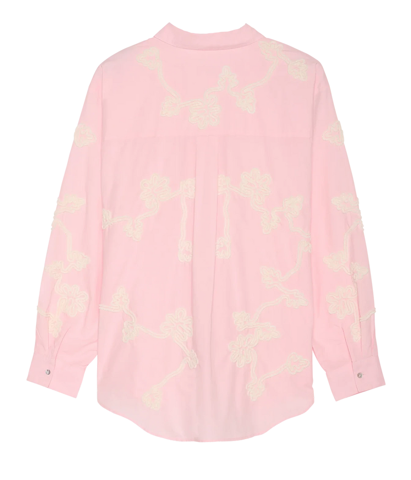 A light pink long-sleeve blouse with cream-colored floral embroidery, shown flat against a white background.