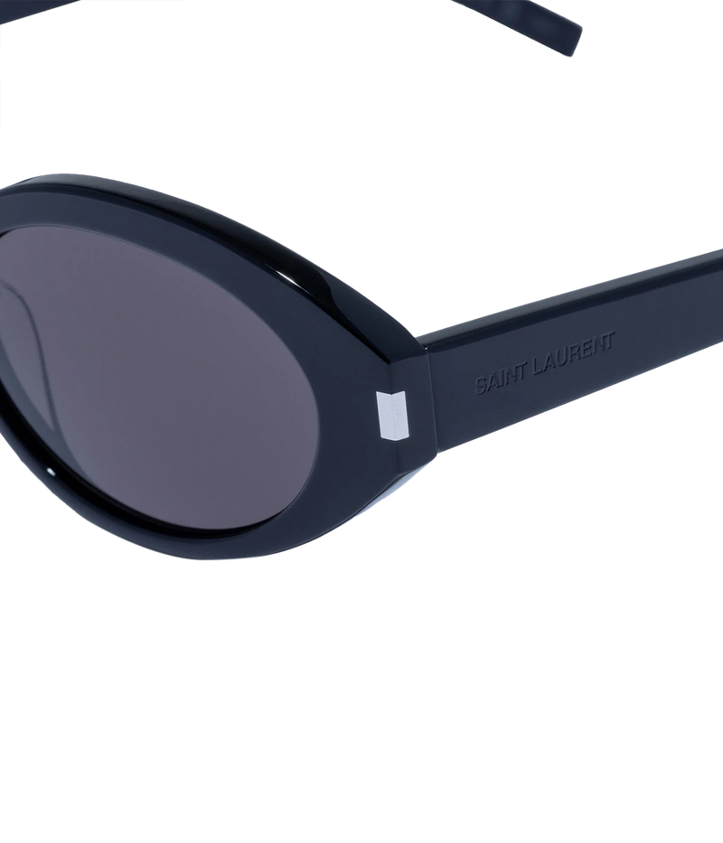Close side view of Saint Laurent SL 567 Oval Sunglasses in Black showing the frame front and temple