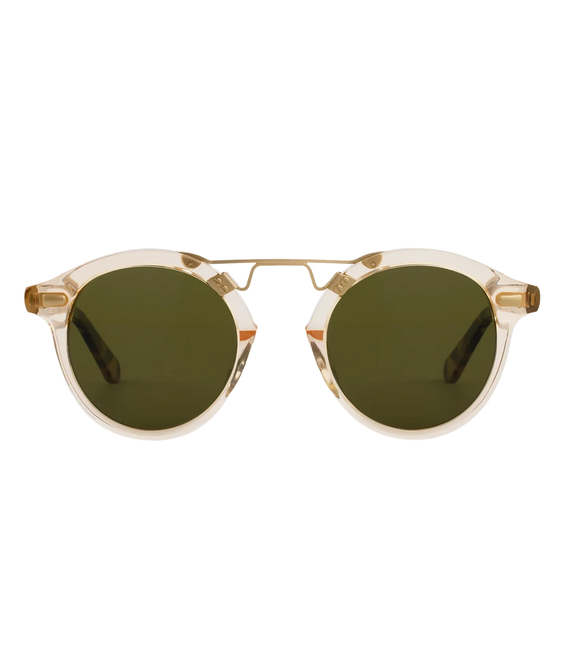 Front view of the KREWE STL II Sunglasses in 12K Haze Iberia, showing the translucent champagne frame, gold brow bar and green lenses