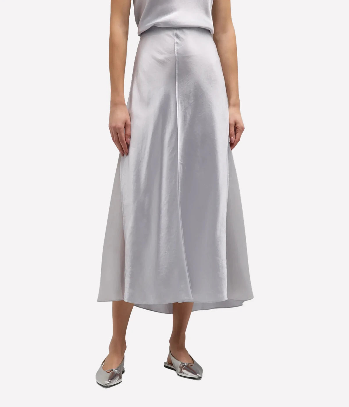 A Vince silver slip skirt with sheer side panels. Straight midi length silhouette, simple and refined, Concealed side-zip closure and an elasticised interior waistband for comfort.  