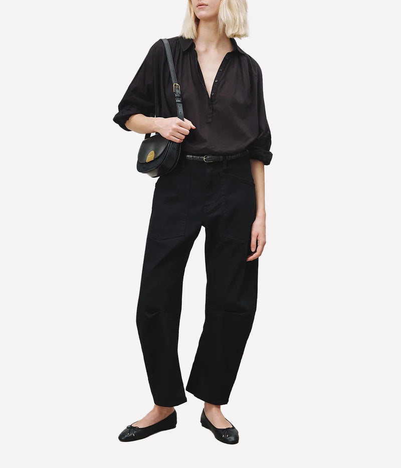 Full length model front view of Nili Lotan Shon Jean in Black women's barrel-leg jeans with a mid-rise waist and relaxed fit