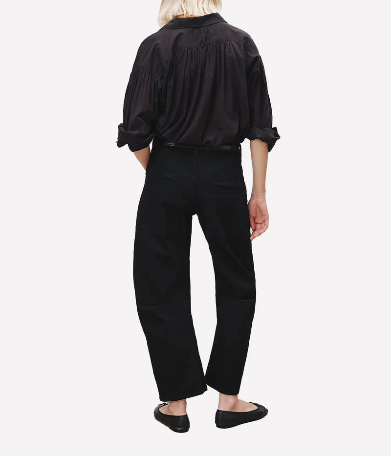 Back view of Nili Lotan Shon Jean in Black featuring patch pockets and a relaxed barrel-leg silhouette.