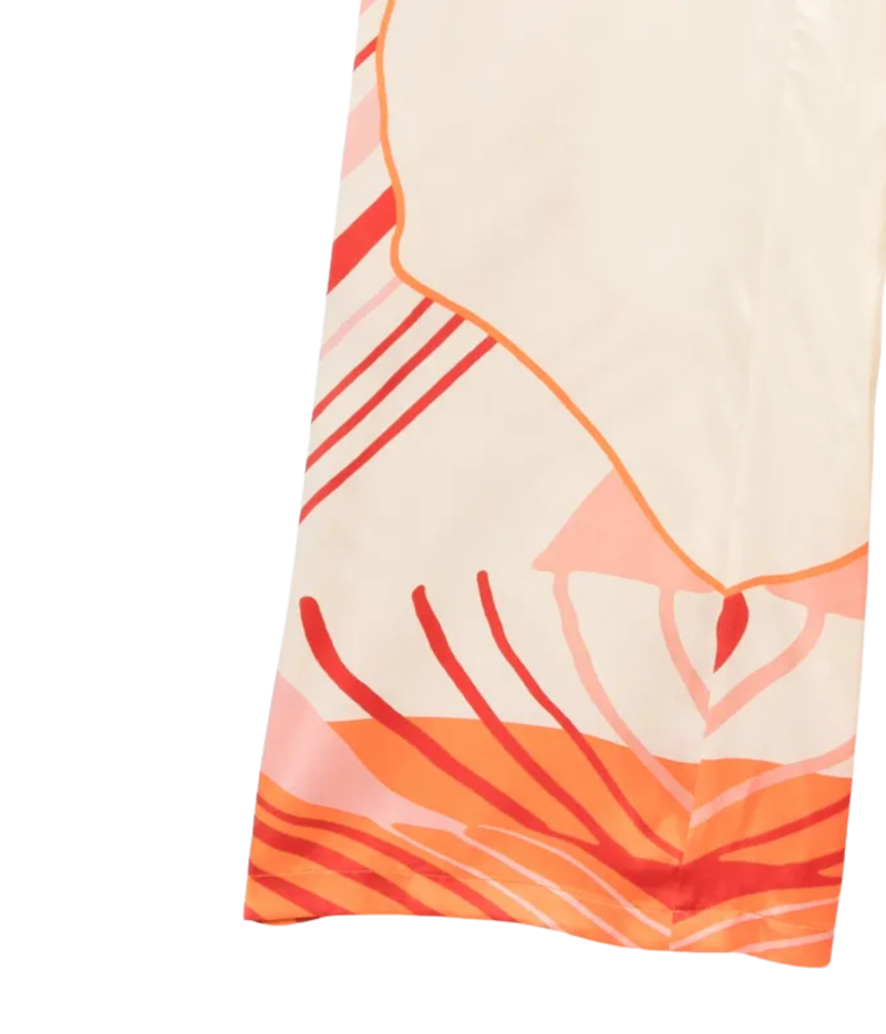 Raquel Diniz Sofia Pants In Ivory Pink Tangerine Red, close-up of the abstract placement print in ivory, pink and tangerine
