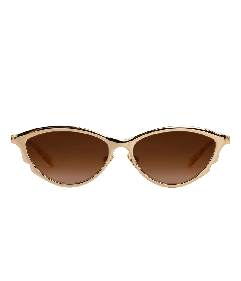 Front view of the KREWE Solange Sunglasses in 18K Chroma Champagne, showing the elongated gold frame, scalloped edge and brown gradient lenses