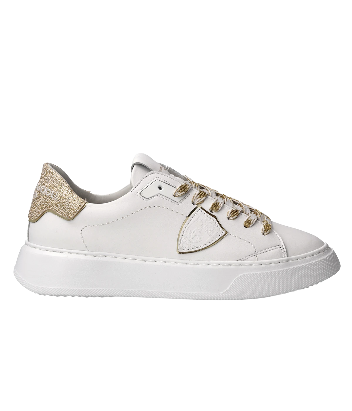 ALT TEXT: White and gold glitter low-top sneaker by Philippe Model. Made in Italy, this low-top sneaker shines with glittery white leather and gold accents, offering a glamorous touch to any outfit.