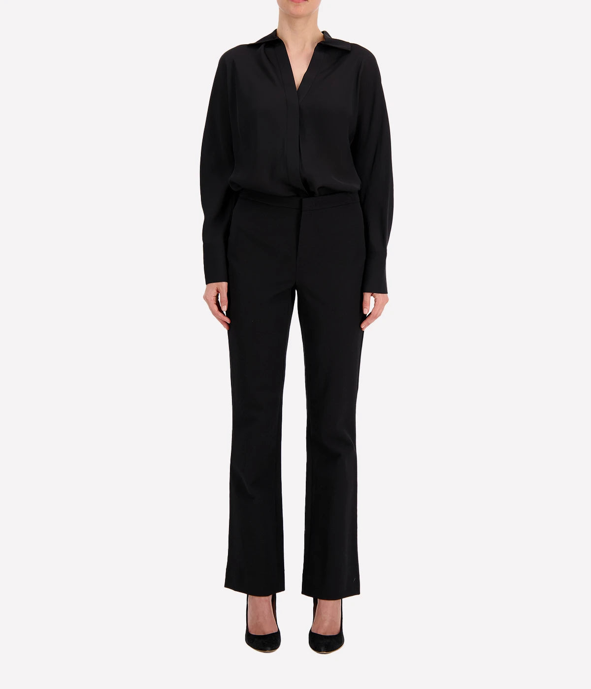 Straight black vince pants with a subtle flare at the hem, perfect for corporate wear with heels.