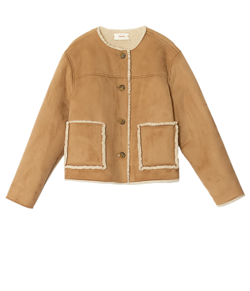 A shearling long sleeve jacket in a camel suede, contrast shearling pocket detailing, button down, winter jacket, bra friendly, made in USA, scoop neckline. 
