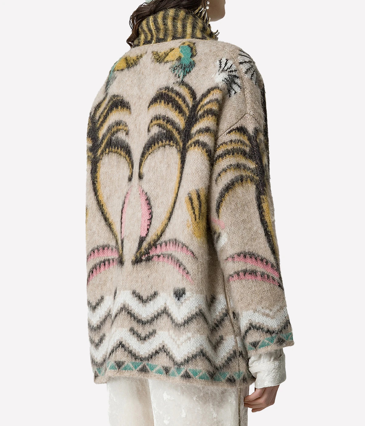 ALT Text: Oversized jacquard cardigan in Oro with an enchanted forest motif, multicoloured fringe detailing, dropped shoulders, and concealed press studs.