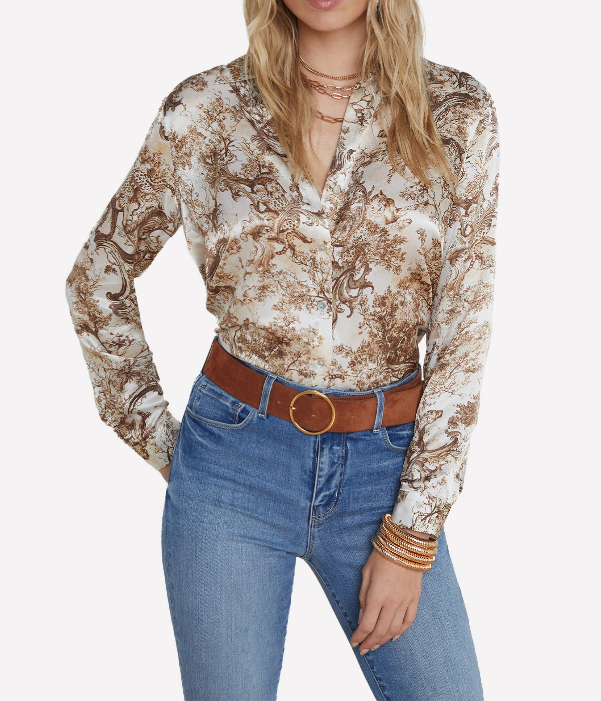 ALT Text: Silk button-down shirt with a sharp collar, pleated back yoke, and long sleeves, offered in various colours and prints.