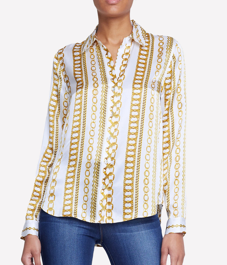 A white silk long sleeve shirt with gold chain details be L'agence.