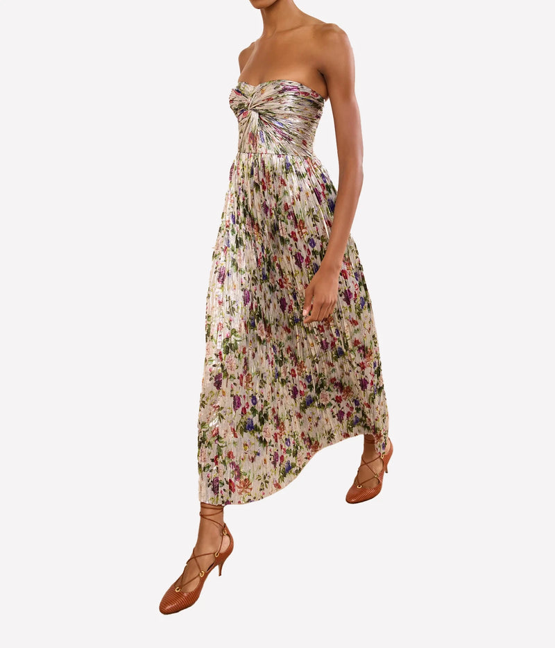 Model wearing Ulla Johnson Adelaide Strapless Pleated Dress in Sterling Floral, side view
