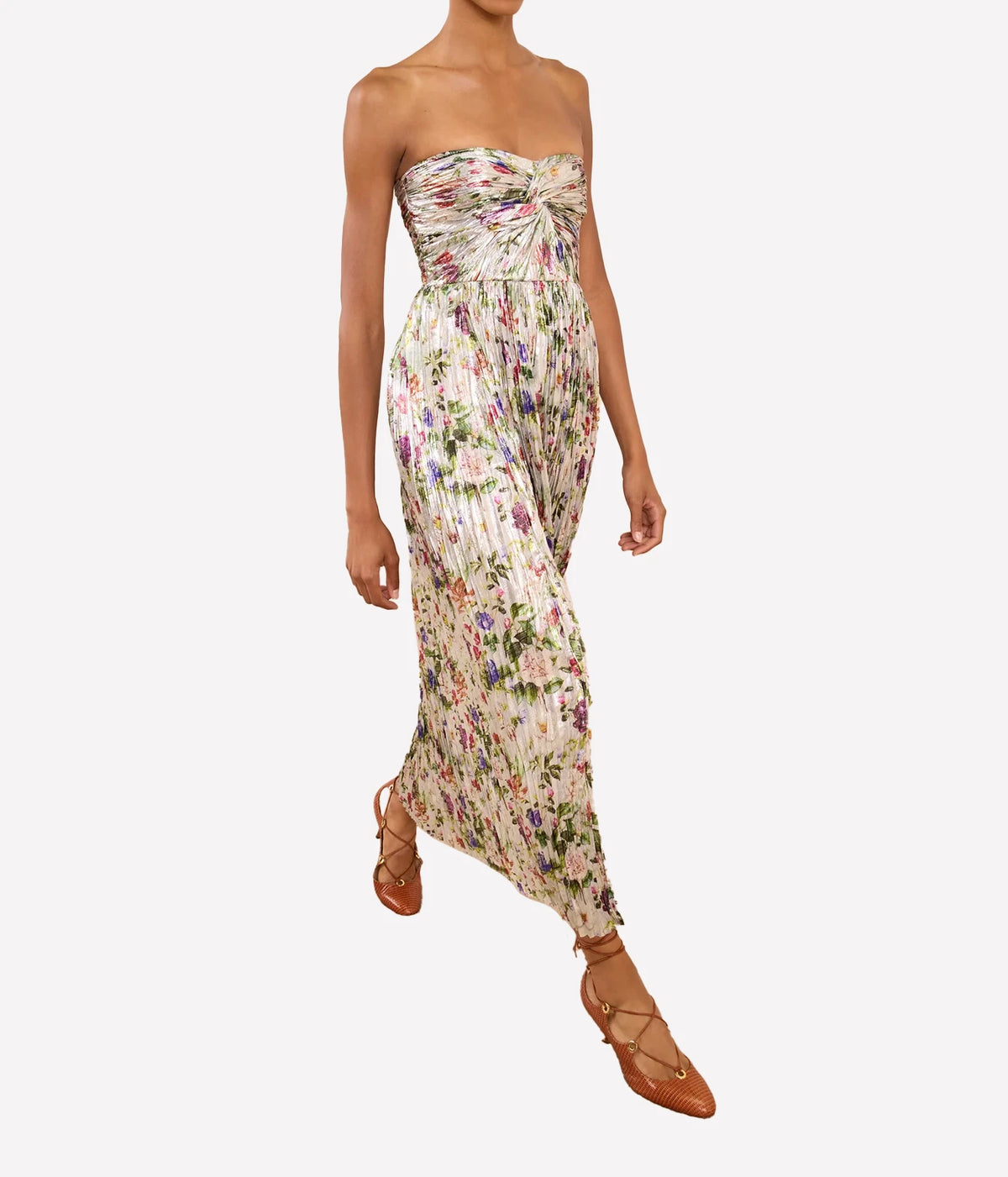 Model wearing Ulla Johnson Adelaide Strapless Pleated Dress in Sterling Floral while walking