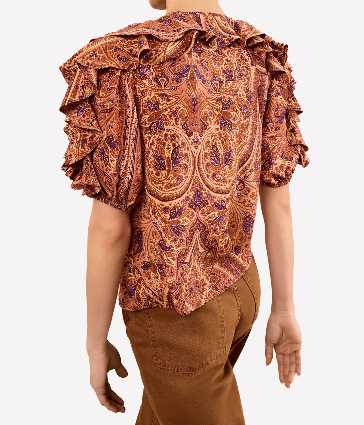 Model wearing Ulla Johnson Josephine Short Sleeve Silk Top in Rosette, back view