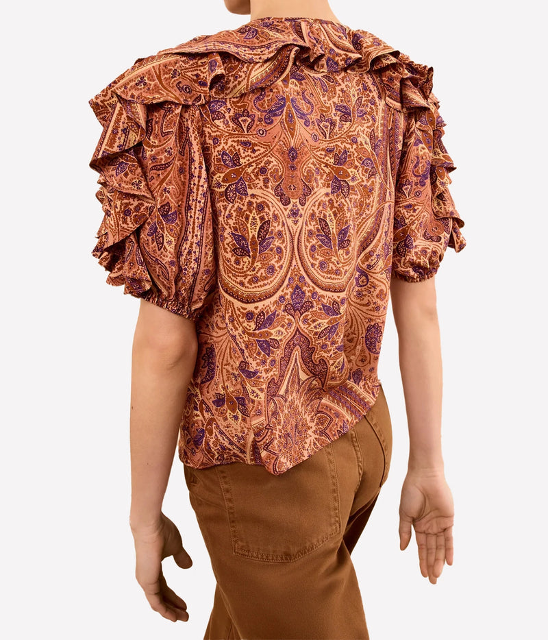 Model wearing Ulla Johnson Josephine Short Sleeve Silk Top in Rosette, back view
