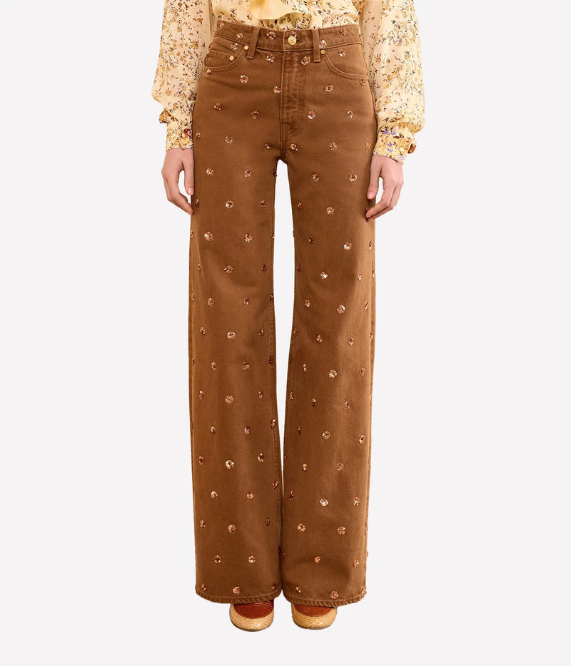Model wearing Ulla Johnson The Willow Embellished Wide Leg Jean in Umber, back view