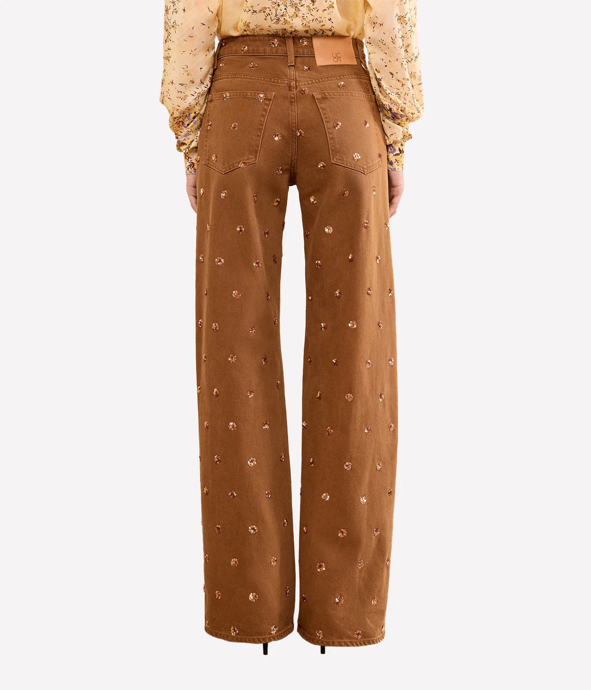 Model wearing Ulla Johnson The Willow Embellished Wide Leg Jean in Umber, front view