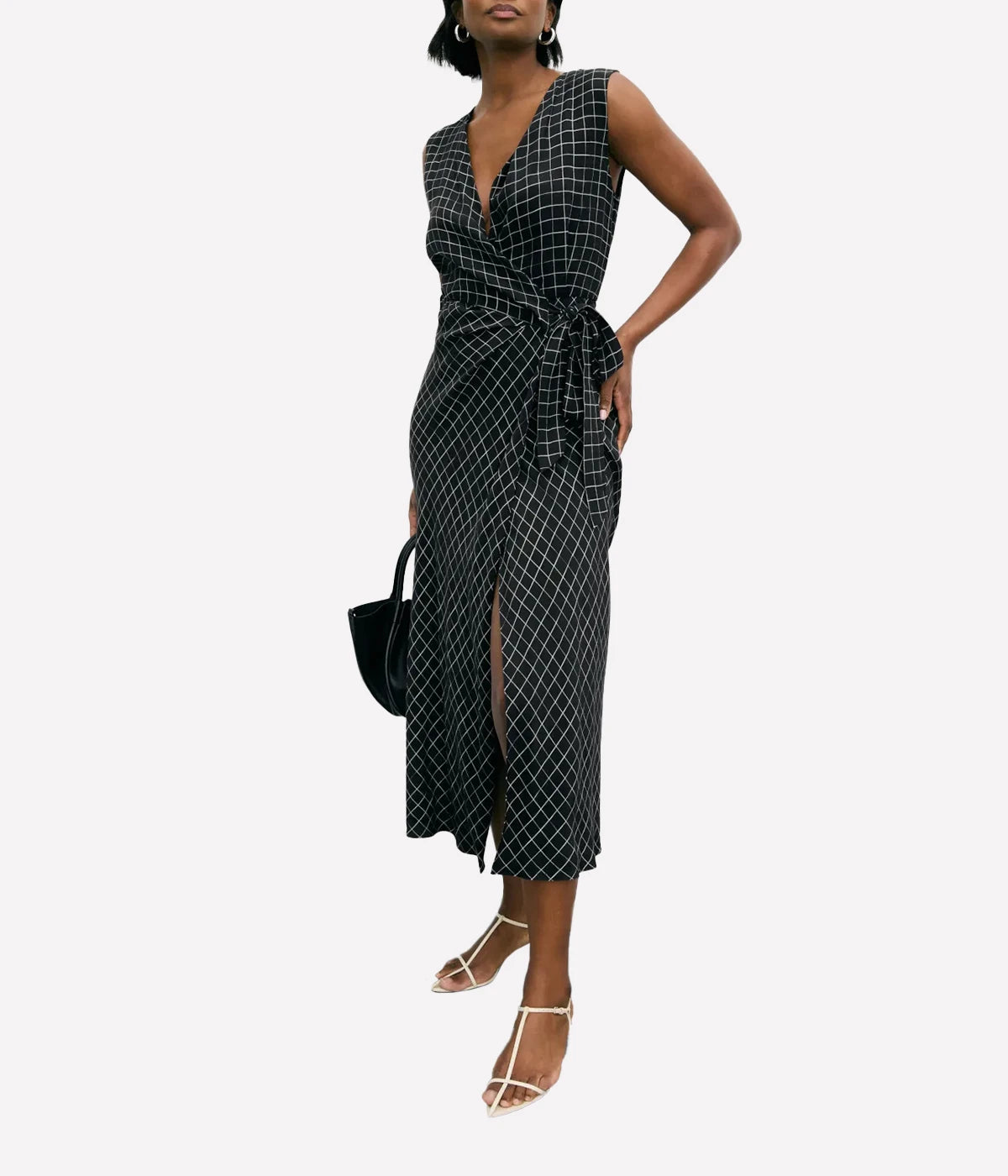 Vince Trellis Wrap Dress featuring pleated crepe fabric in a trellis-inspired check pattern, with a side tie closure and flattering 49" length. Perfect for effortless elegance.