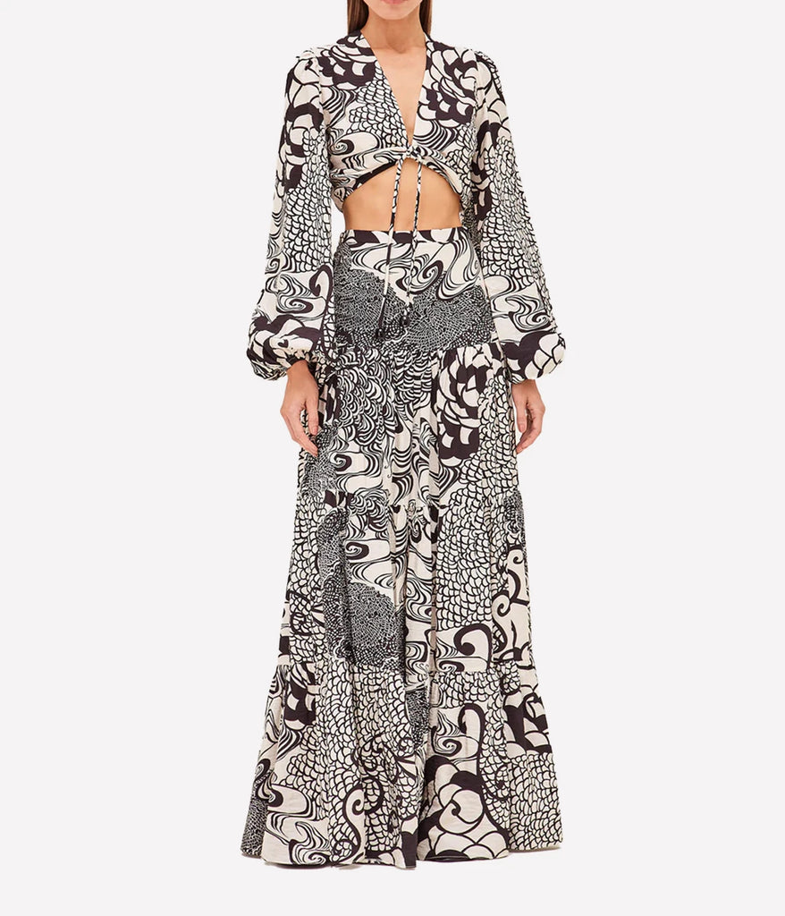 A stylish and comfrotable ruffle maxi skirt in a cream and black floral print, featuring a high waistline, zipper closure and tiered hemline. Matching set, comfortable, made internationally, date night outfit, special event.